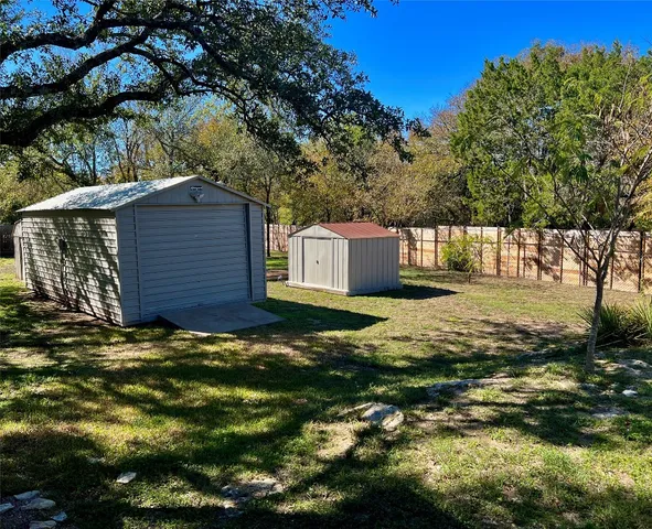 a view of house with backyard and porch