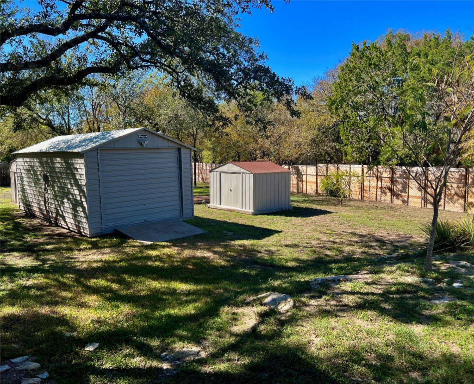 16001 Awalt Drive Austin, TX 78734 - Photo 17 of 22 a backyard of a house with lots of green space