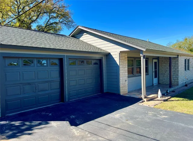 a view of a yard with swimming pool