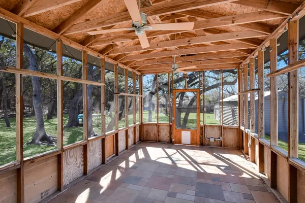 a view of a backyard with sitting area