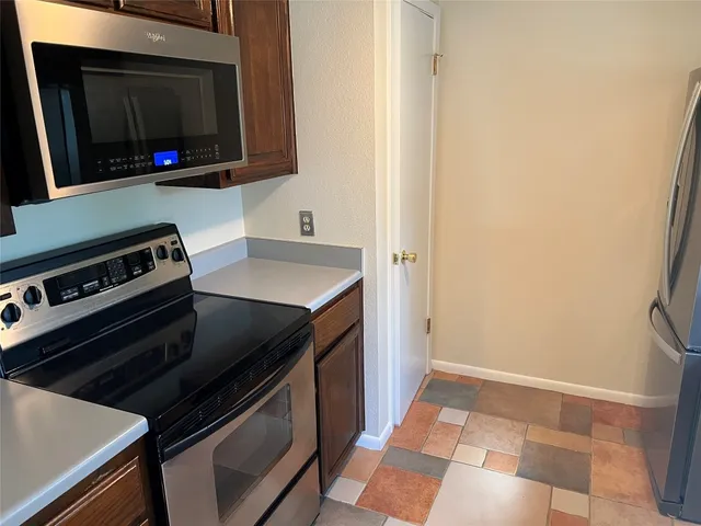 a kitchen with a stove and a microwave