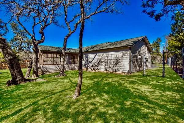 a view interior of a house and chandelier fan windows and kitchen view