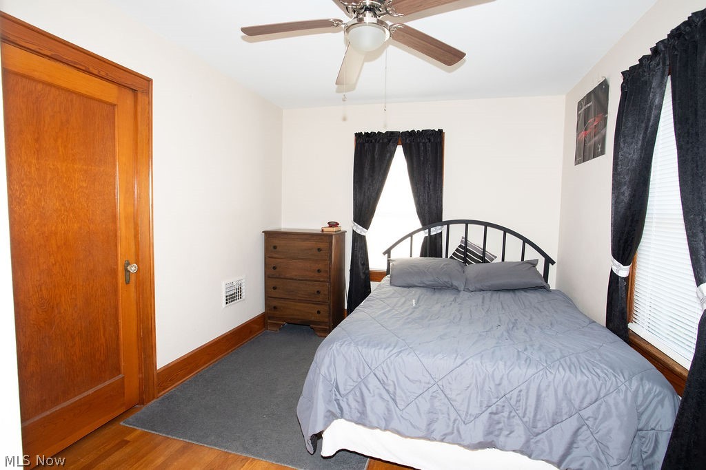 213 Como Street Struthers, OH 44471 - Photo 9 of 25 2nd bedroom with wood floors and ceiling fan