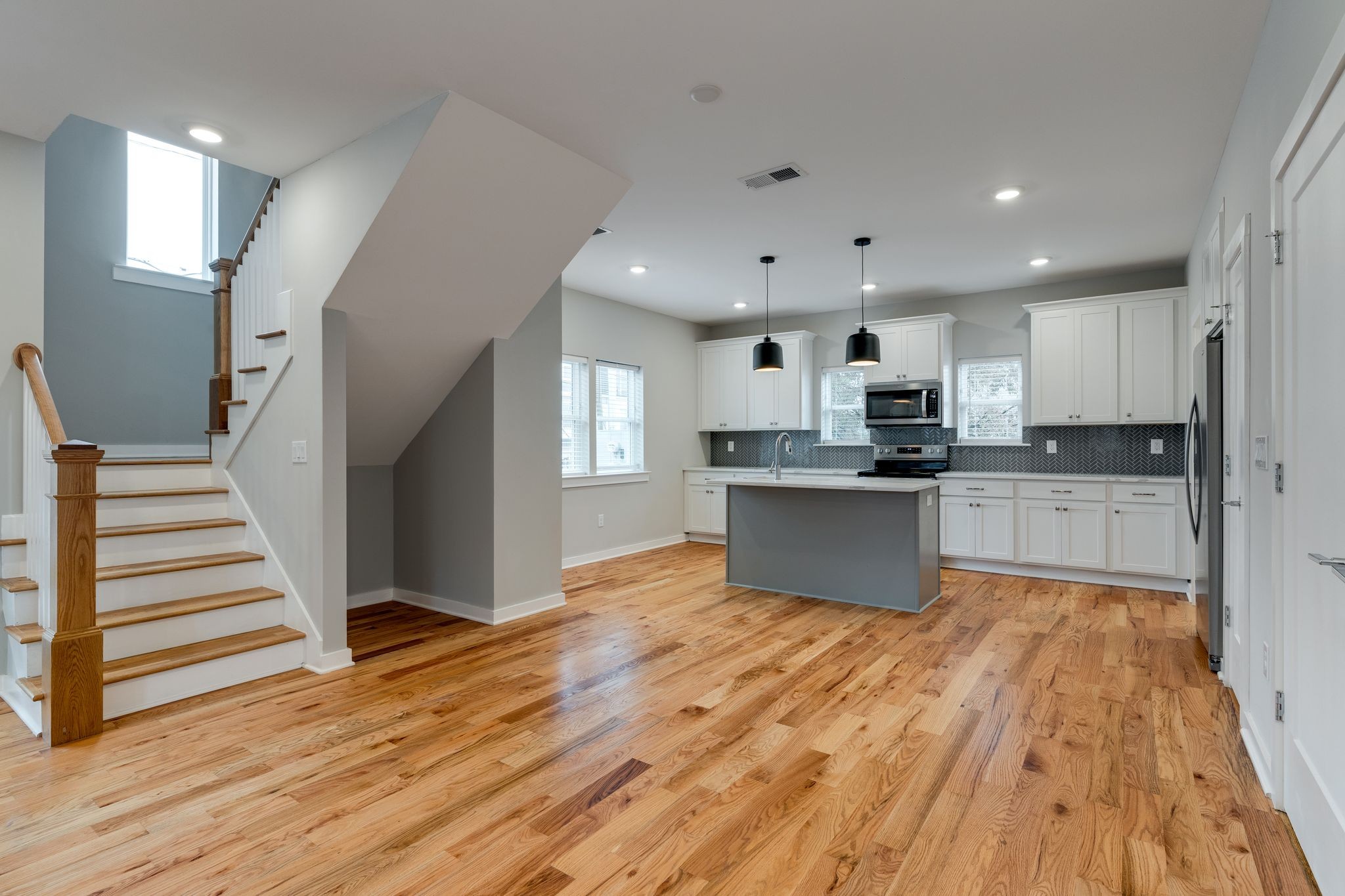 109 A Duke Street Nashville, TN 37207 - Photo 7 of 26 a large kitchen with cabinets and wooden floor