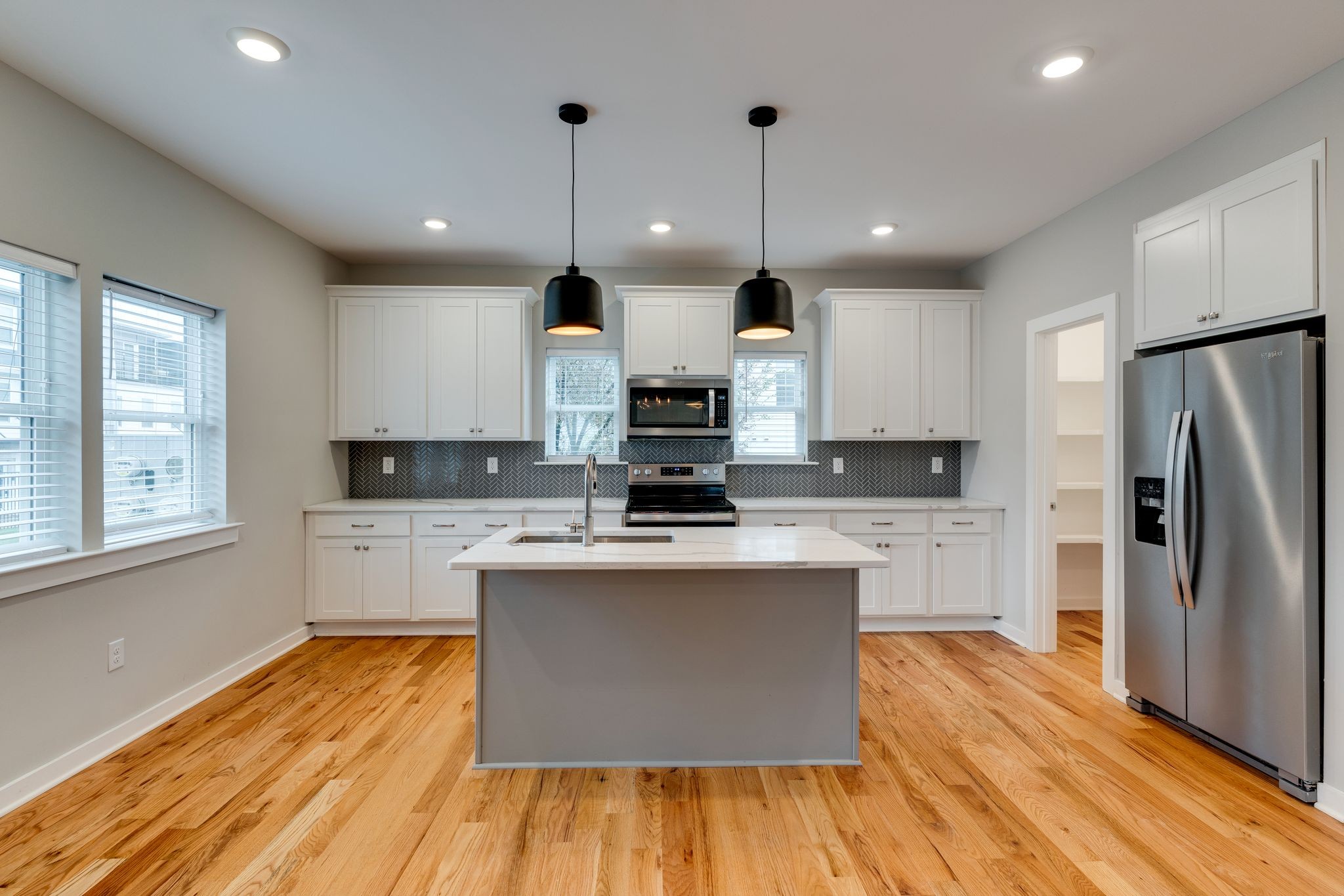 109 A Duke Street Nashville, TN 37207 - Photo 8 of 26 a kitchen with stainless steel appliances granite countertop a sink a stove and a refrigerator