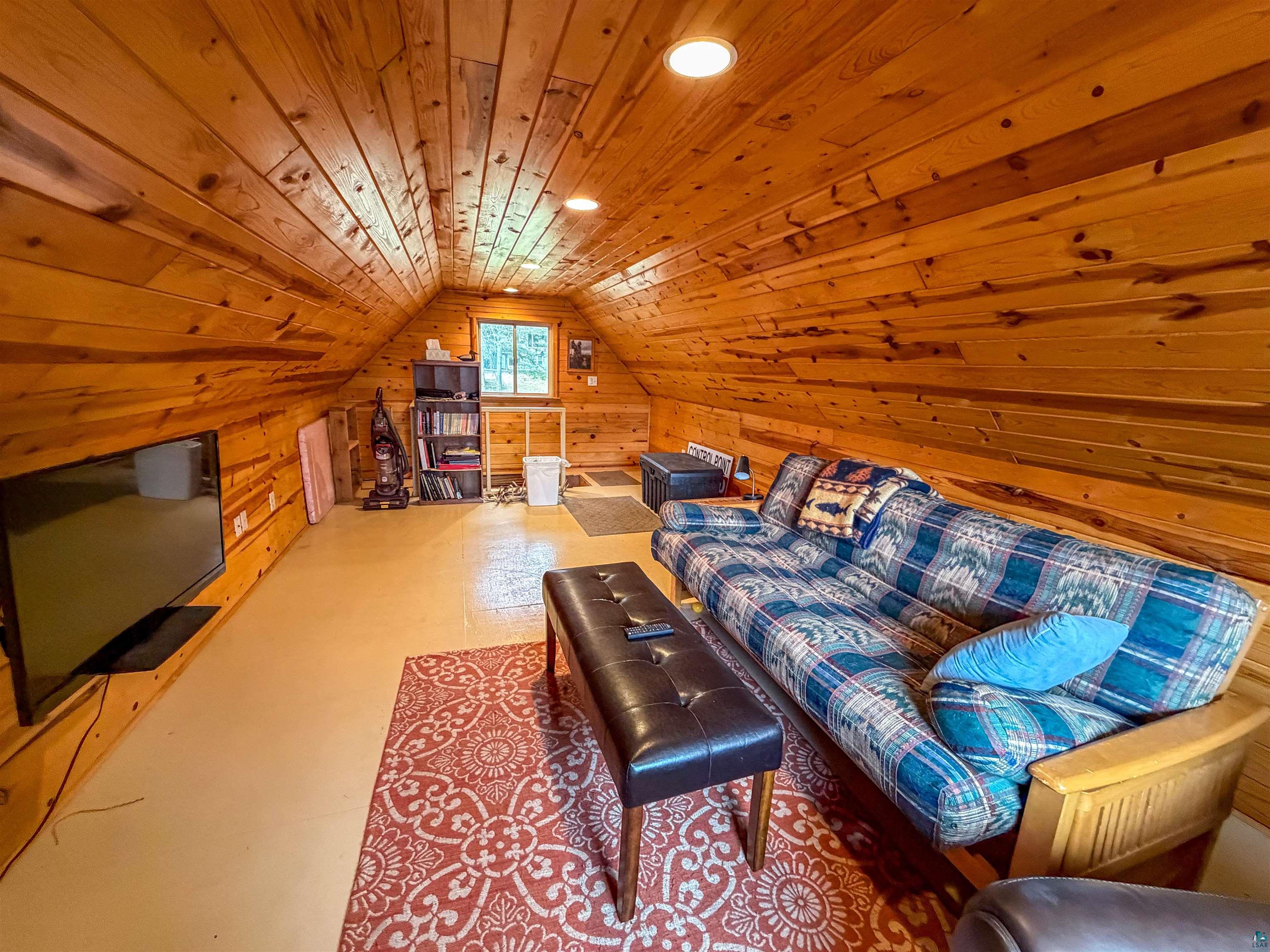 3704 Greysolon Road Duluth, MN 55804 - Photo 49 of 51 Attic space featuring knotty pine paneling, recessed lighting, and a window