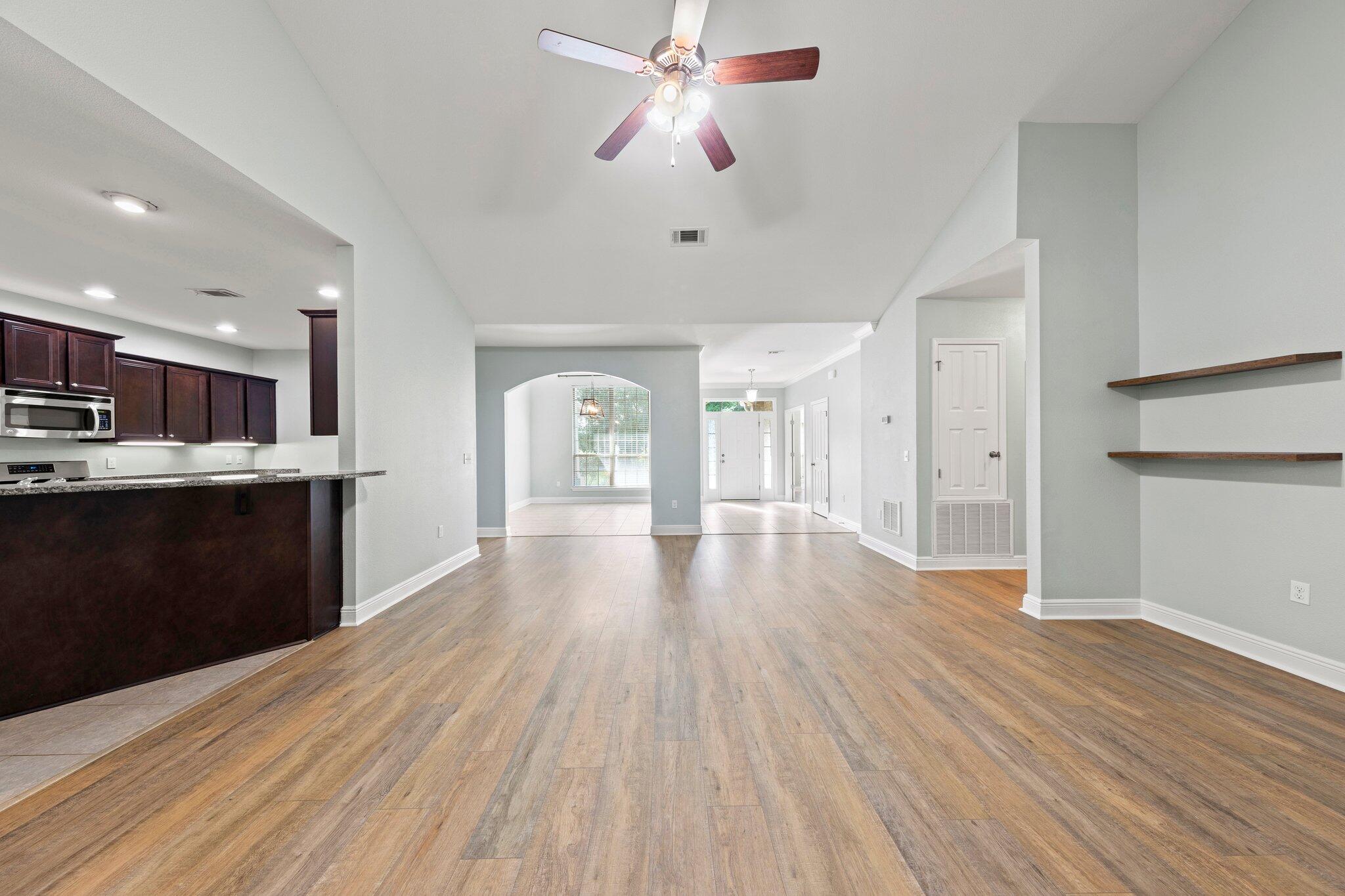 208 Foxchase Way Crestview, FL 32536 - Photo 12 of 51 a view of a kitchen with wooden floor and a kitchen