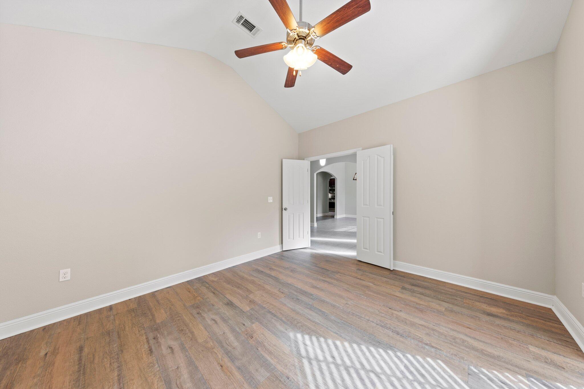 208 Foxchase Way Crestview, FL 32536 - Photo 22 of 51 a view of empty room with wooden floor