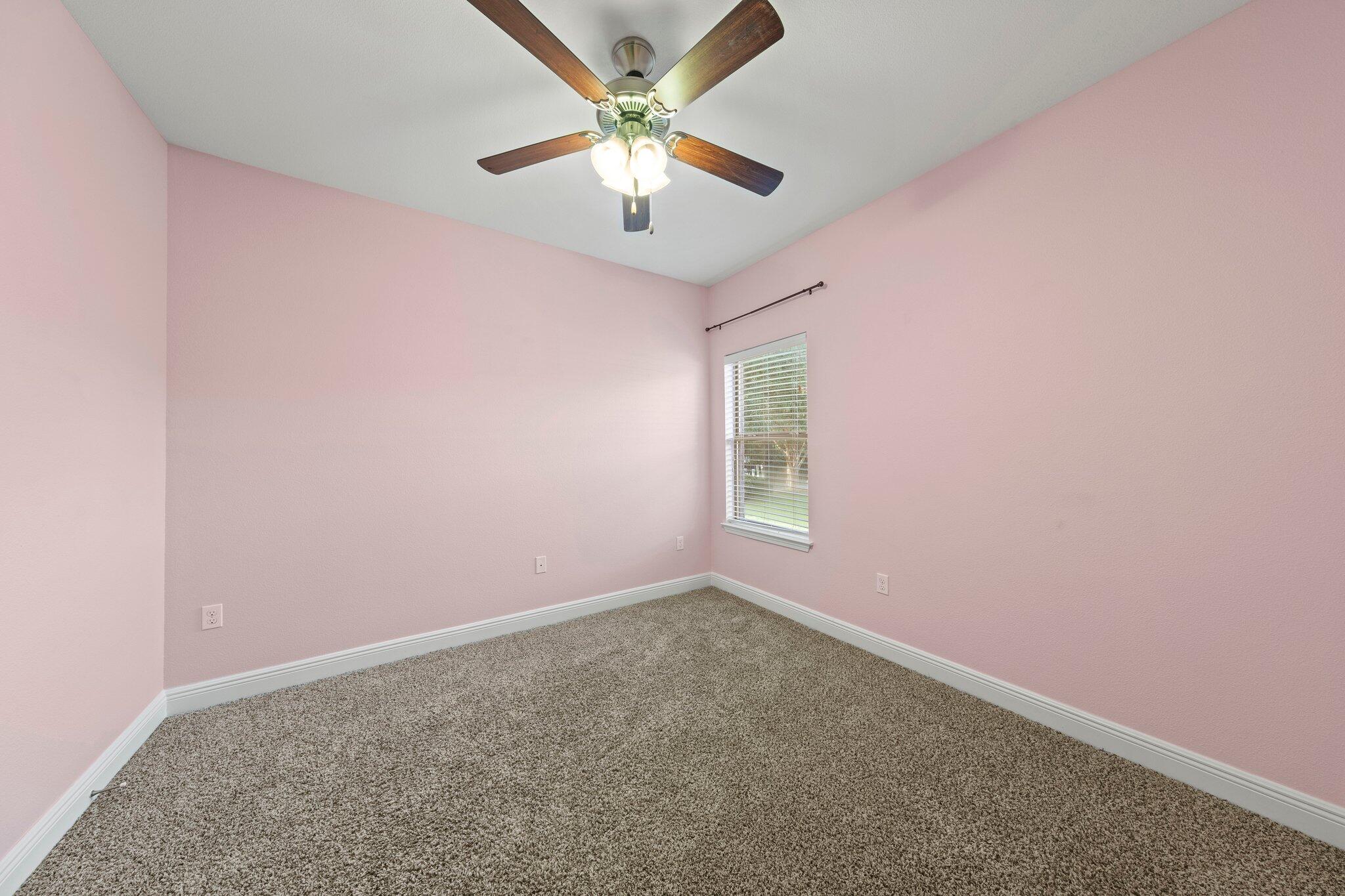 208 Foxchase Way Crestview, FL 32536 - Photo 32 of 51 an empty room with a window and a fan