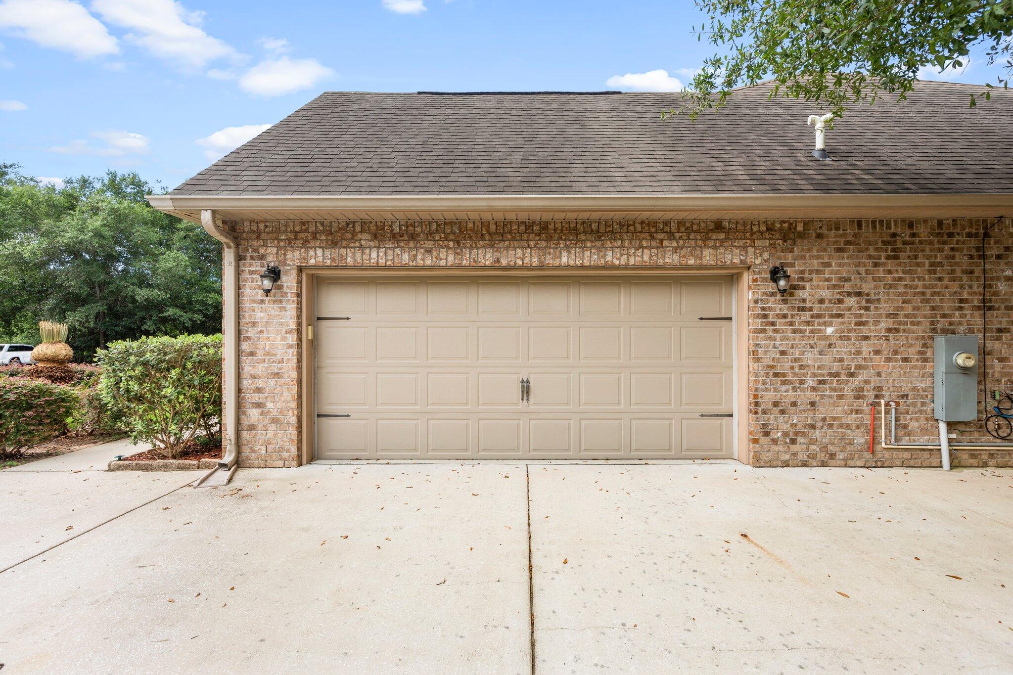 208 Foxchase Way Crestview, FL 32536 - Photo 4 of 51 front view of a stone house with a large parking space