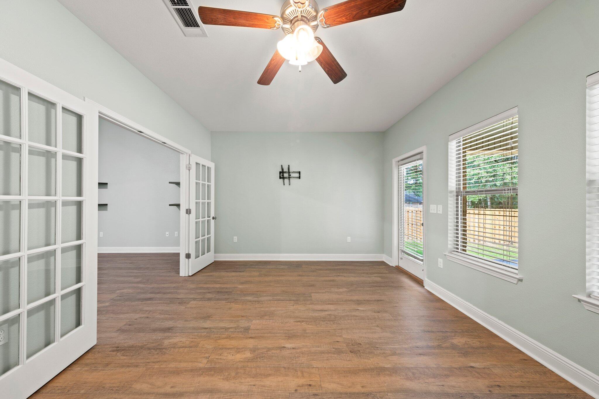 208 Foxchase Way Crestview, FL 32536 - Photo 42 of 51 wooden floor in an empty room with a window