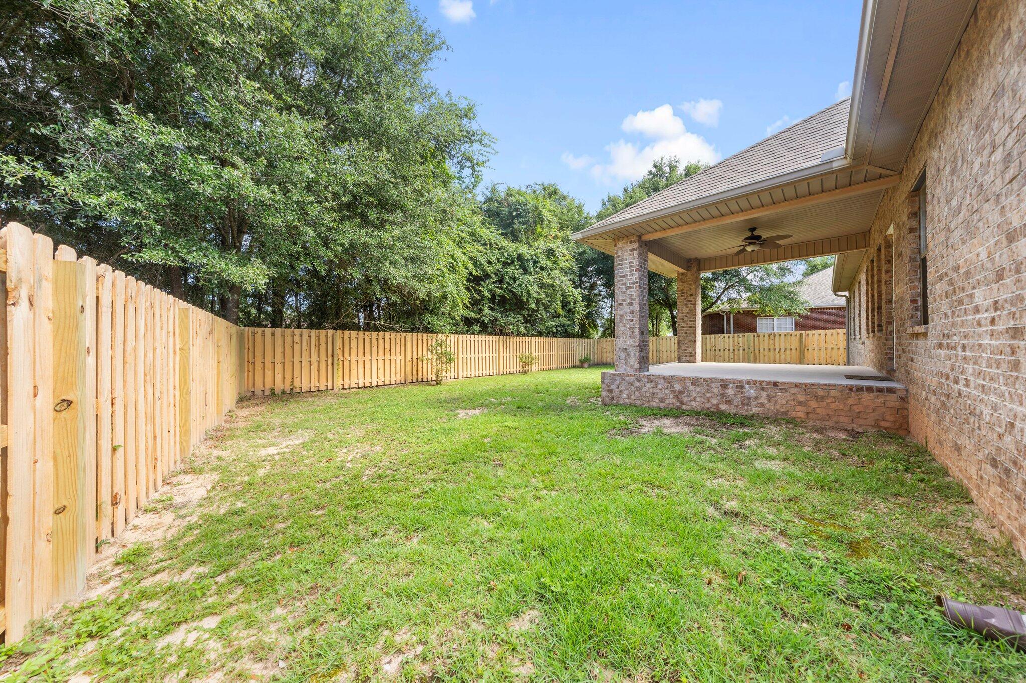 208 Foxchase Way Crestview, FL 32536 - Photo 46 of 51 a view of a backyard with a garden