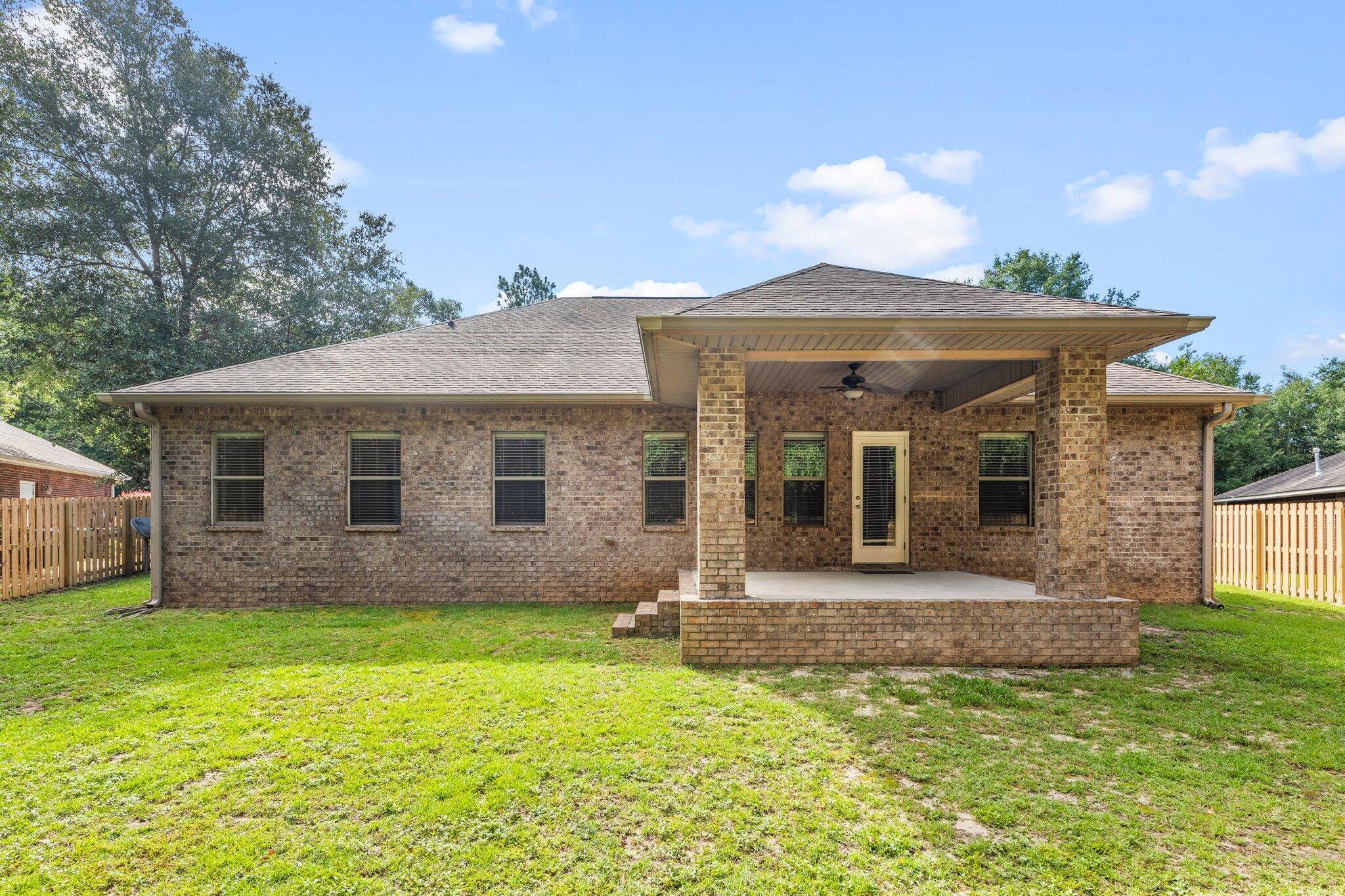 208 Foxchase Way Crestview, FL 32536 - Photo 48 of 51 a front view of a house with garden