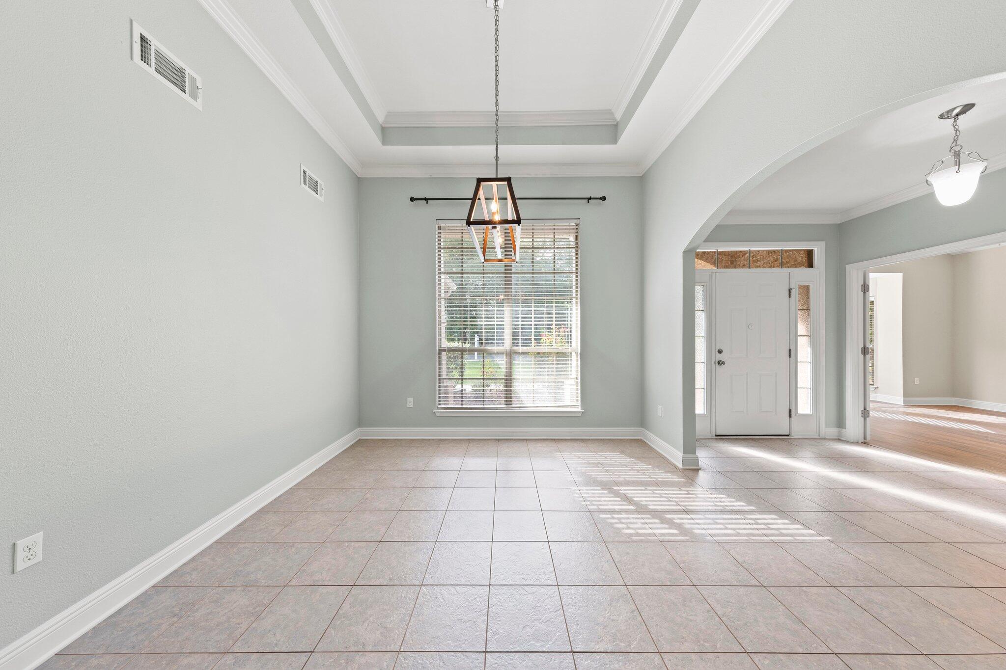 208 Foxchase Way Crestview, FL 32536 - Photo 9 of 51 a view of an empty room with glass door
