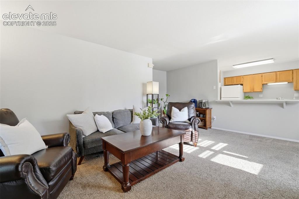 4357 Hunting Meadows Circle Colorado Springs, CO 80916 - Photo 5 of 20 a living room with furniture and a window