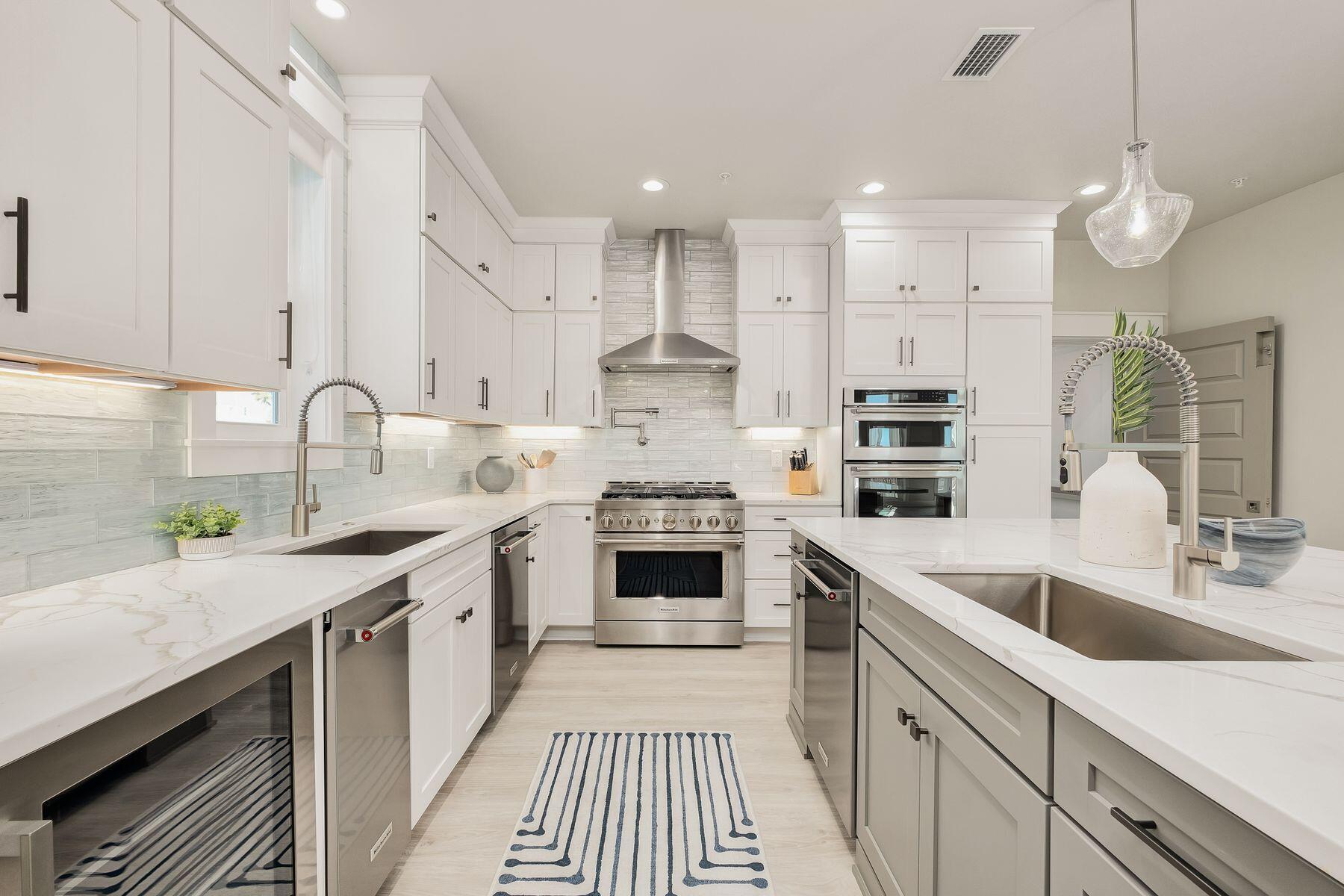76 Hotz Avenue Santa Rosa Beach, FL 32459 - Photo 11 of 70 a kitchen with stainless steel appliances granite countertop a sink and cabinets