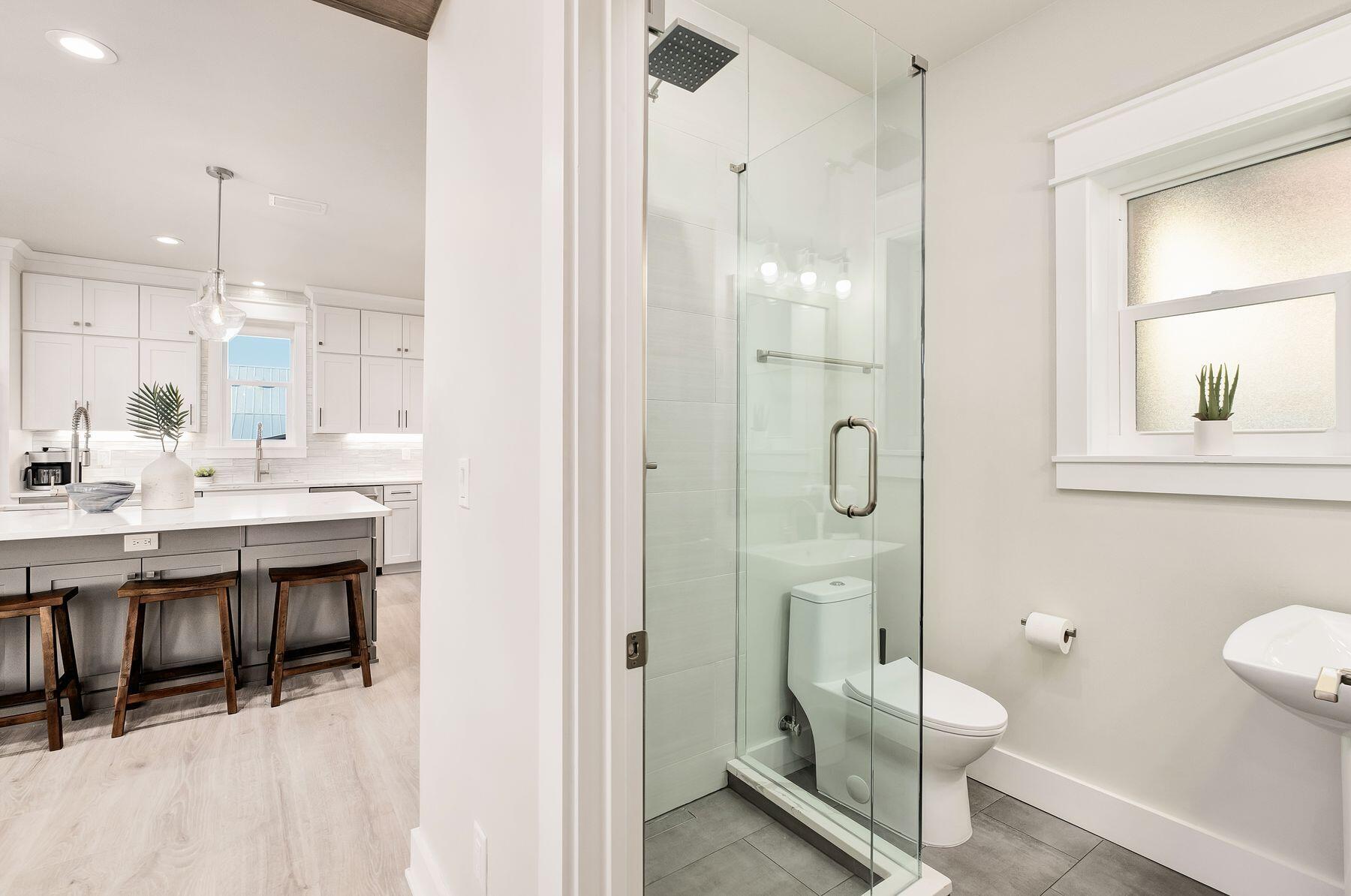 76 Hotz Avenue Santa Rosa Beach, FL 32459 - Photo 19 of 70 a bathroom with a double vanity sink a toilet and shower