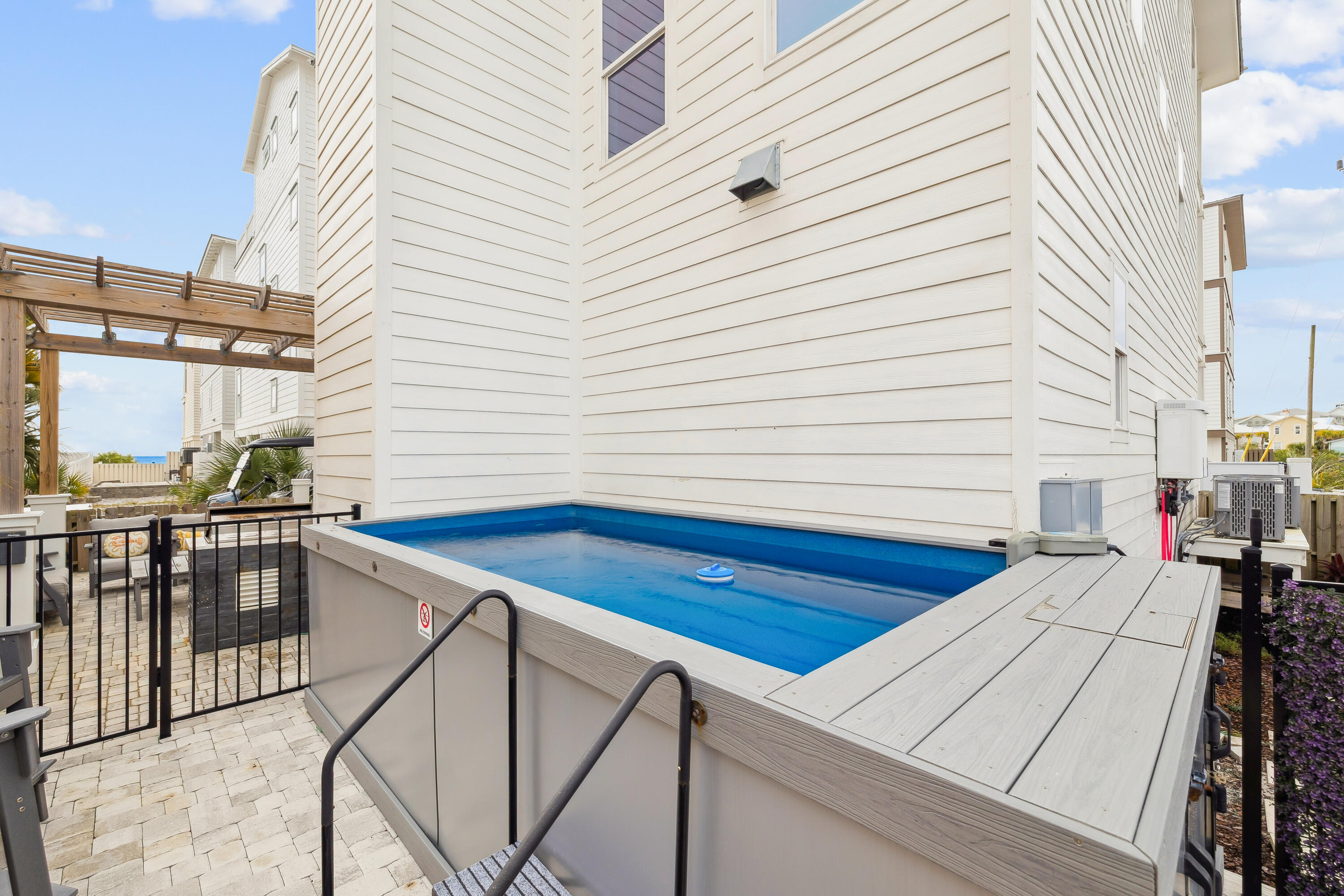 76 Hotz Avenue Santa Rosa Beach, FL 32459 - Photo 22 of 71 a view of a balcony with wooden floor and furniture