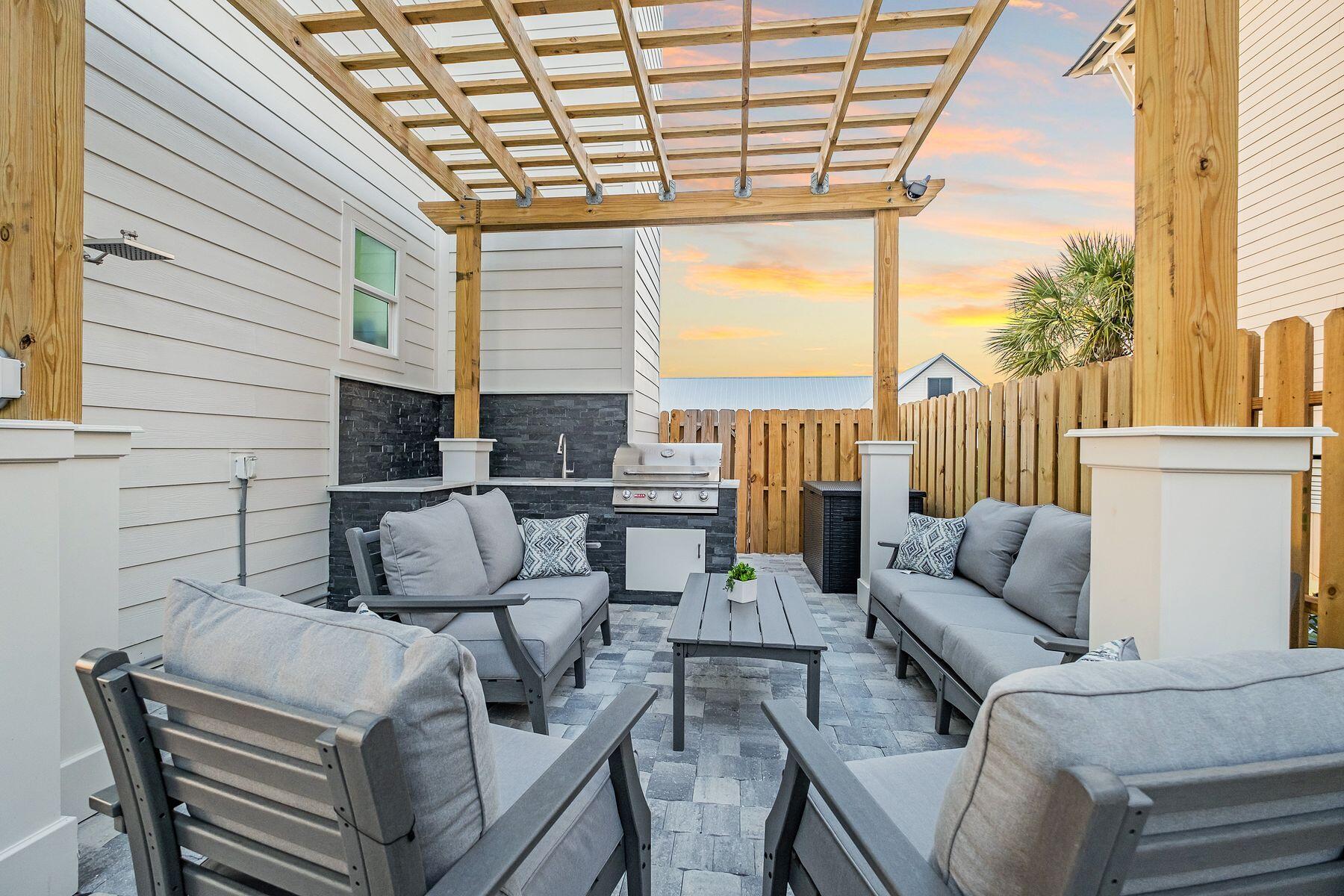 76 Hotz Avenue Santa Rosa Beach, FL 32459 - Photo 22 of 70 a outdoor living space with patio furniture and garden view