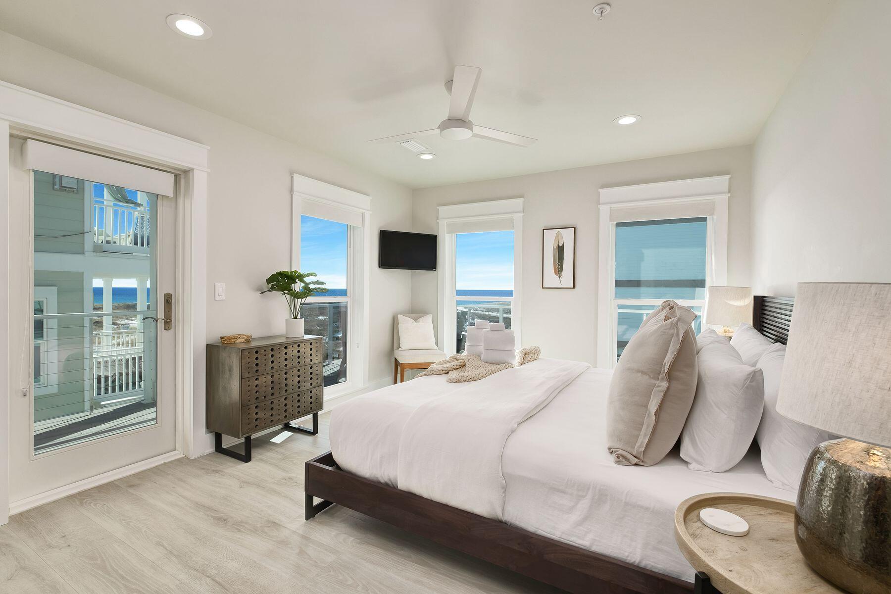 76 Hotz Avenue Santa Rosa Beach, FL 32459 - Photo 31 of 70 a bedroom with furniture and a fireplace