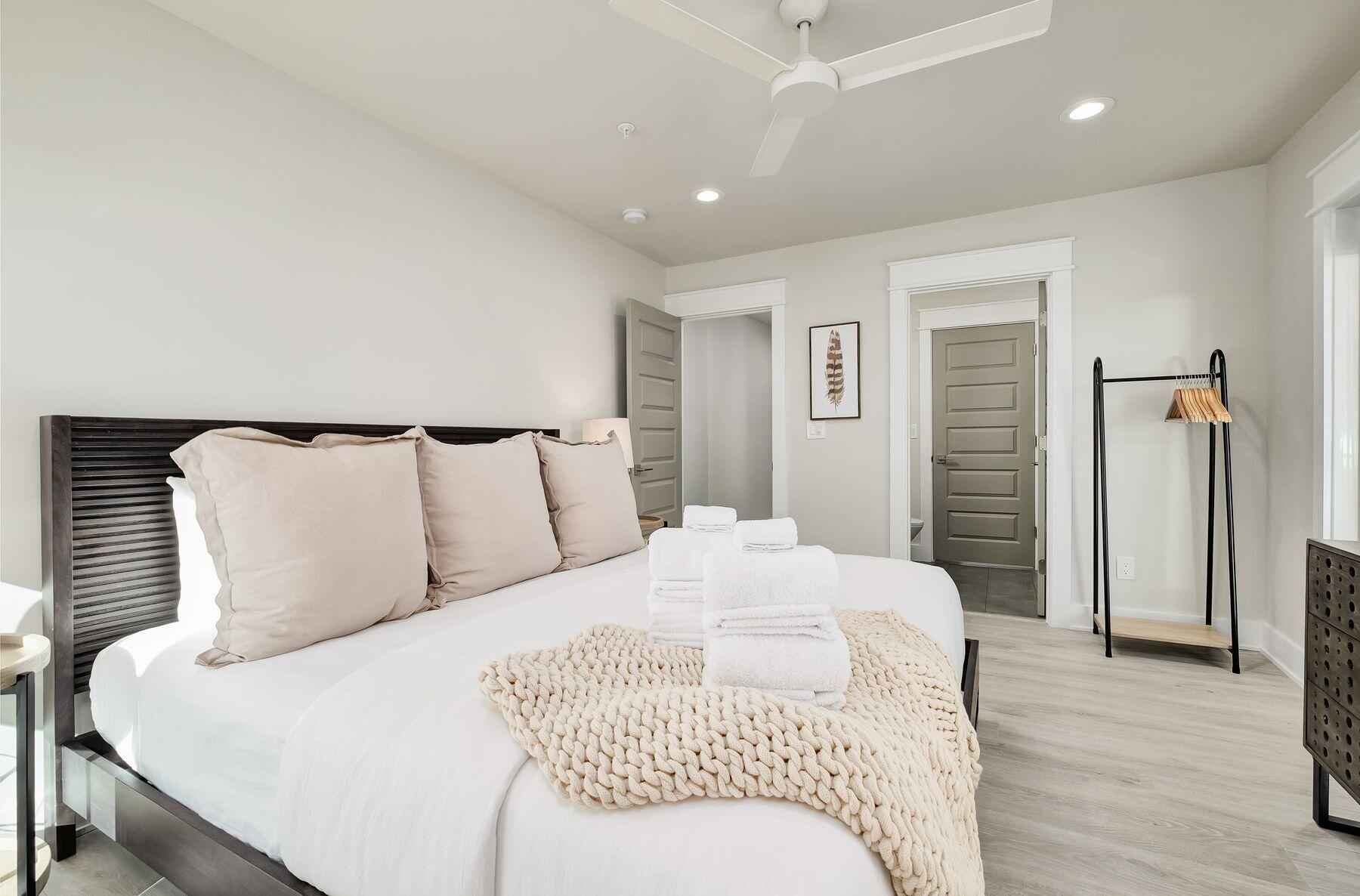 76 Hotz Avenue Santa Rosa Beach, FL 32459 - Photo 32 of 70 a bedroom with a bed and wooden floor