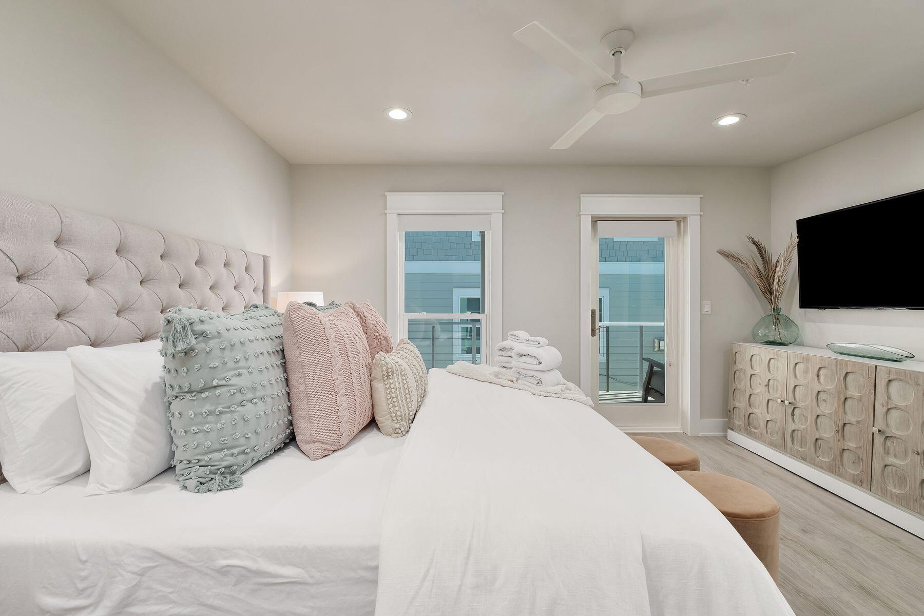76 Hotz Avenue Santa Rosa Beach, FL 32459 - Photo 38 of 70 a bedroom with a large bed and a flat screen tv