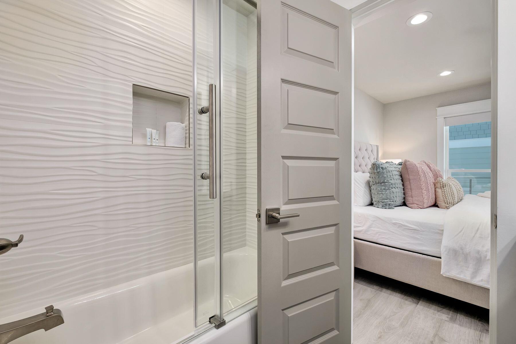 76 Hotz Avenue Santa Rosa Beach, FL 32459 - Photo 41 of 70 a bathroom with a bathtub and a shower