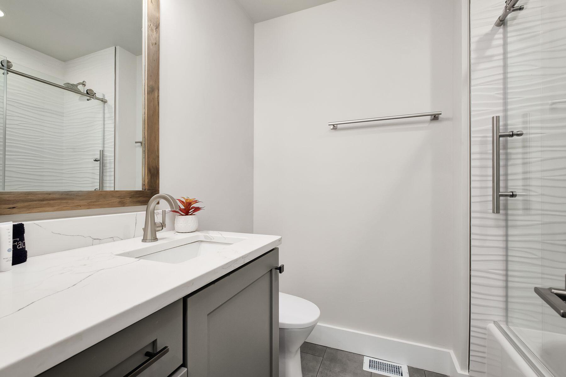 76 Hotz Avenue Santa Rosa Beach, FL 32459 - Photo 42 of 70 a bathroom with a sink toilet and vanity
