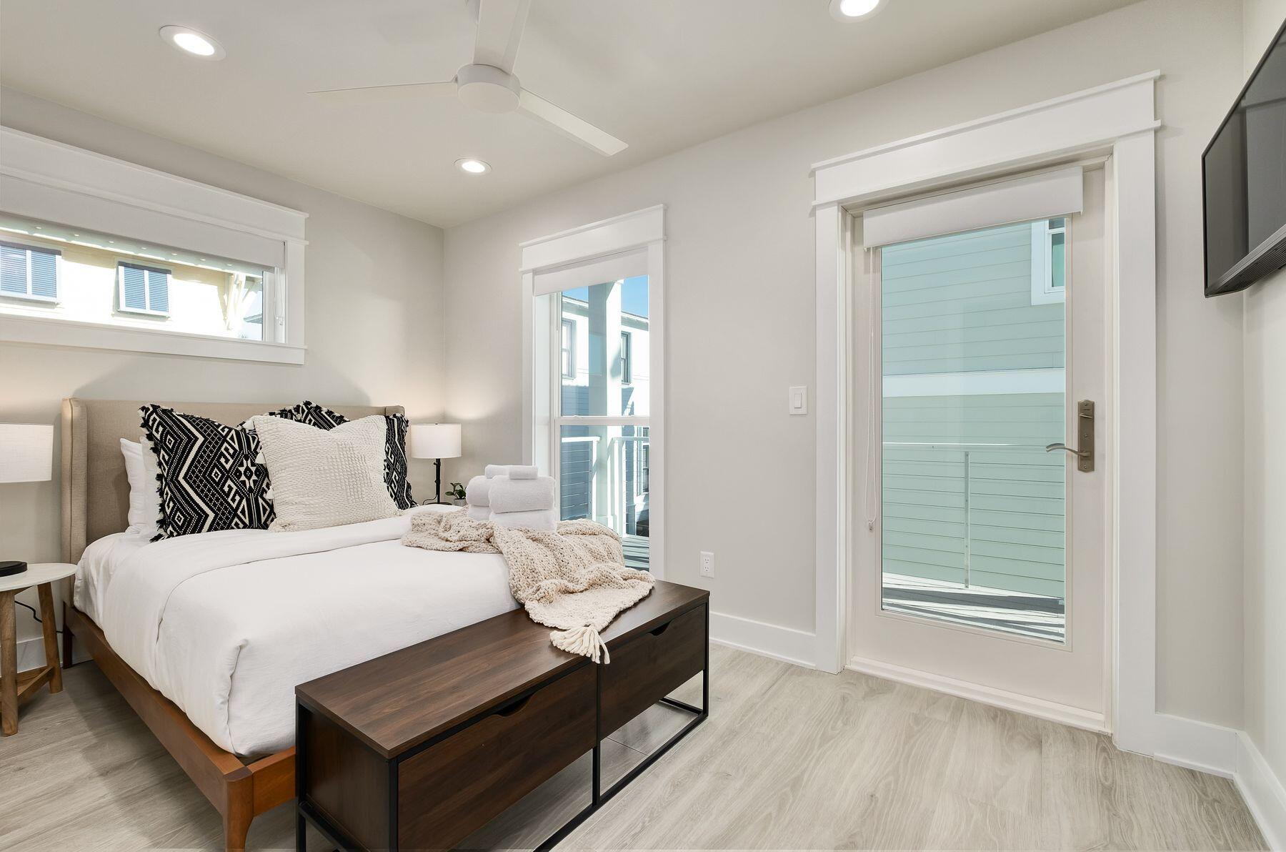 76 Hotz Avenue Santa Rosa Beach, FL 32459 - Photo 45 of 70 a spacious bedroom with a bed and a window