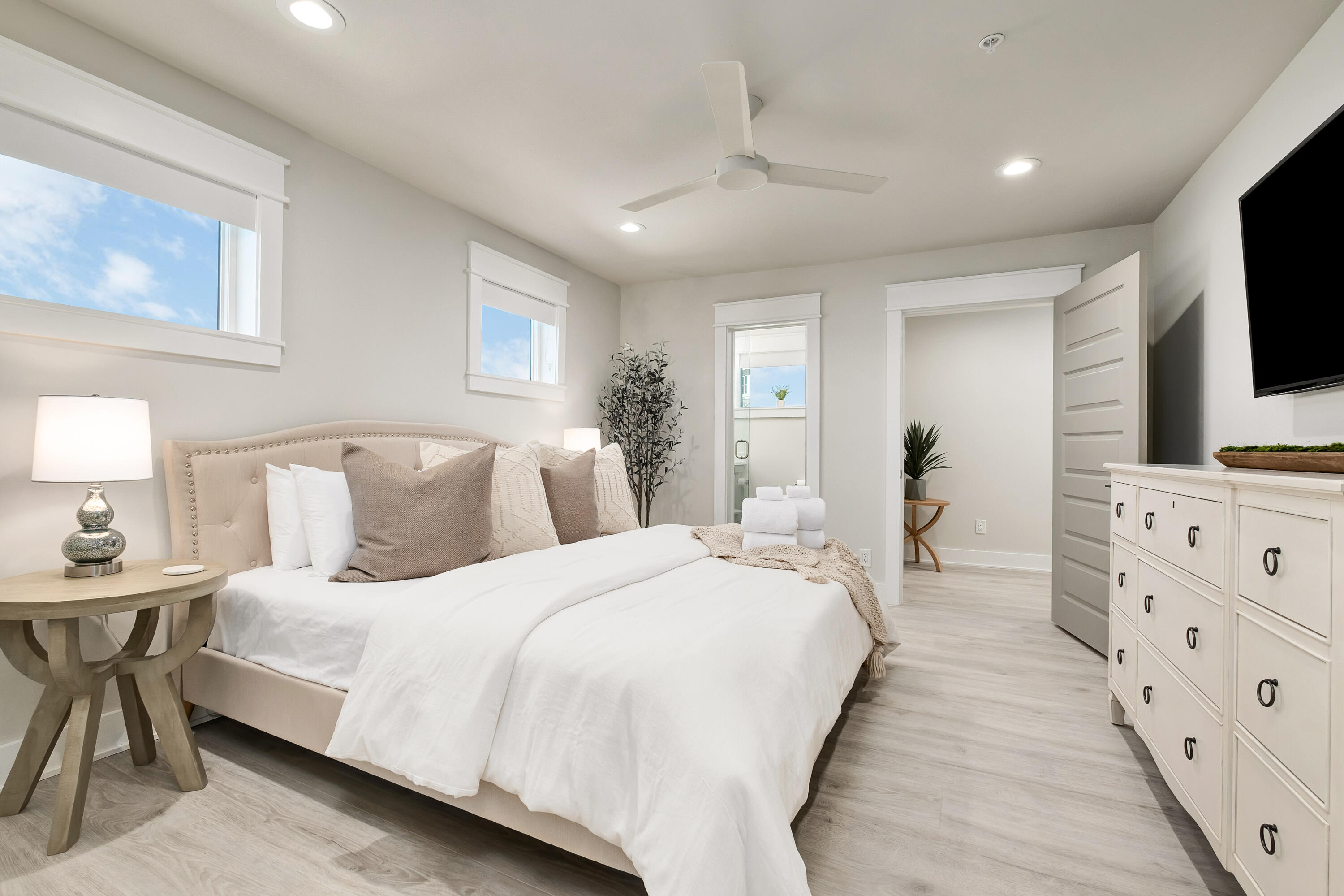 76 Hotz Avenue Santa Rosa Beach, FL 32459 - Photo 48 of 71 a bedroom with bed a flat tv screen and a dresser