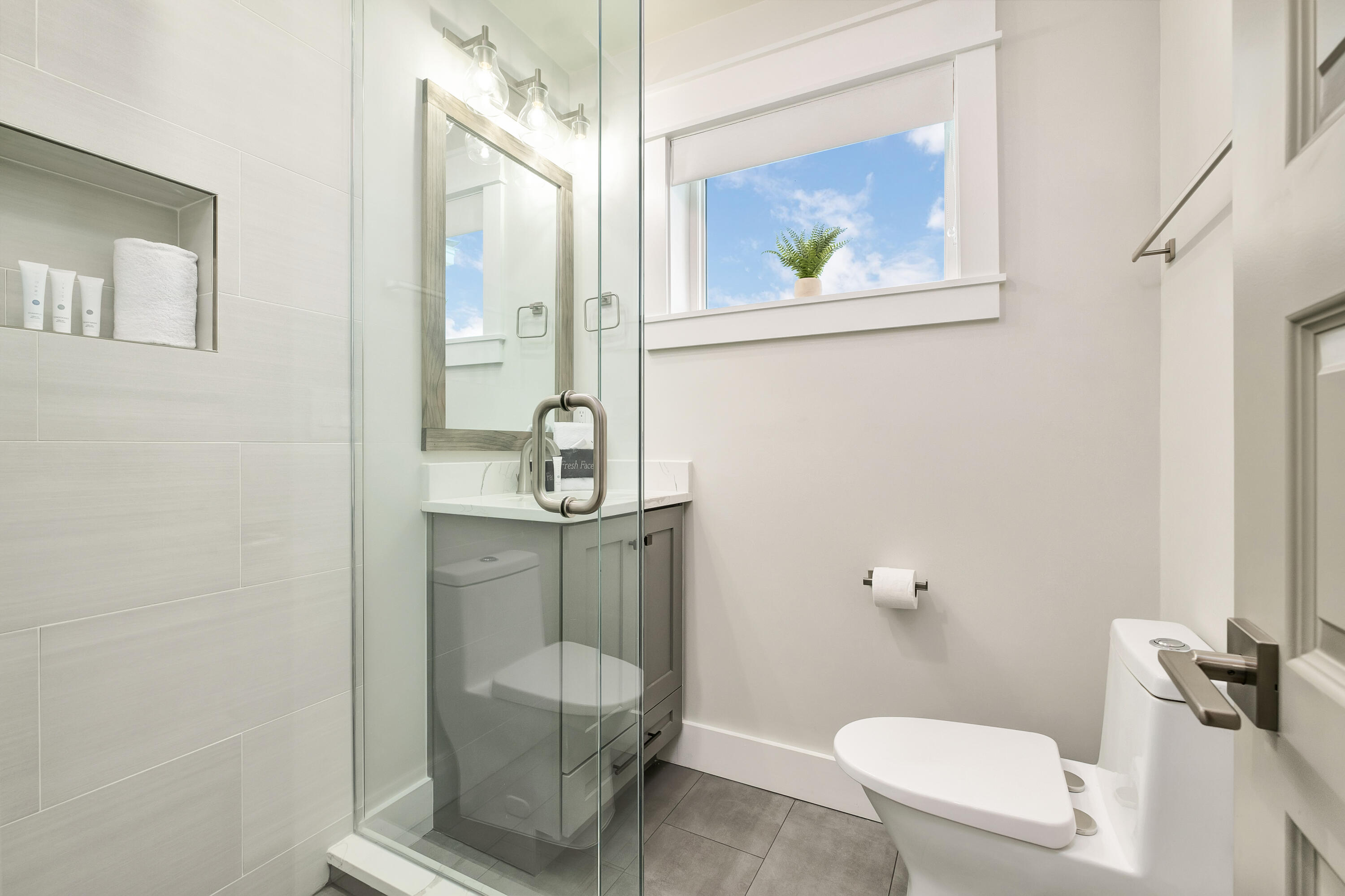 76 Hotz Avenue Santa Rosa Beach, FL 32459 - Photo 50 of 71 a bathroom with a toilet a sink and mirror