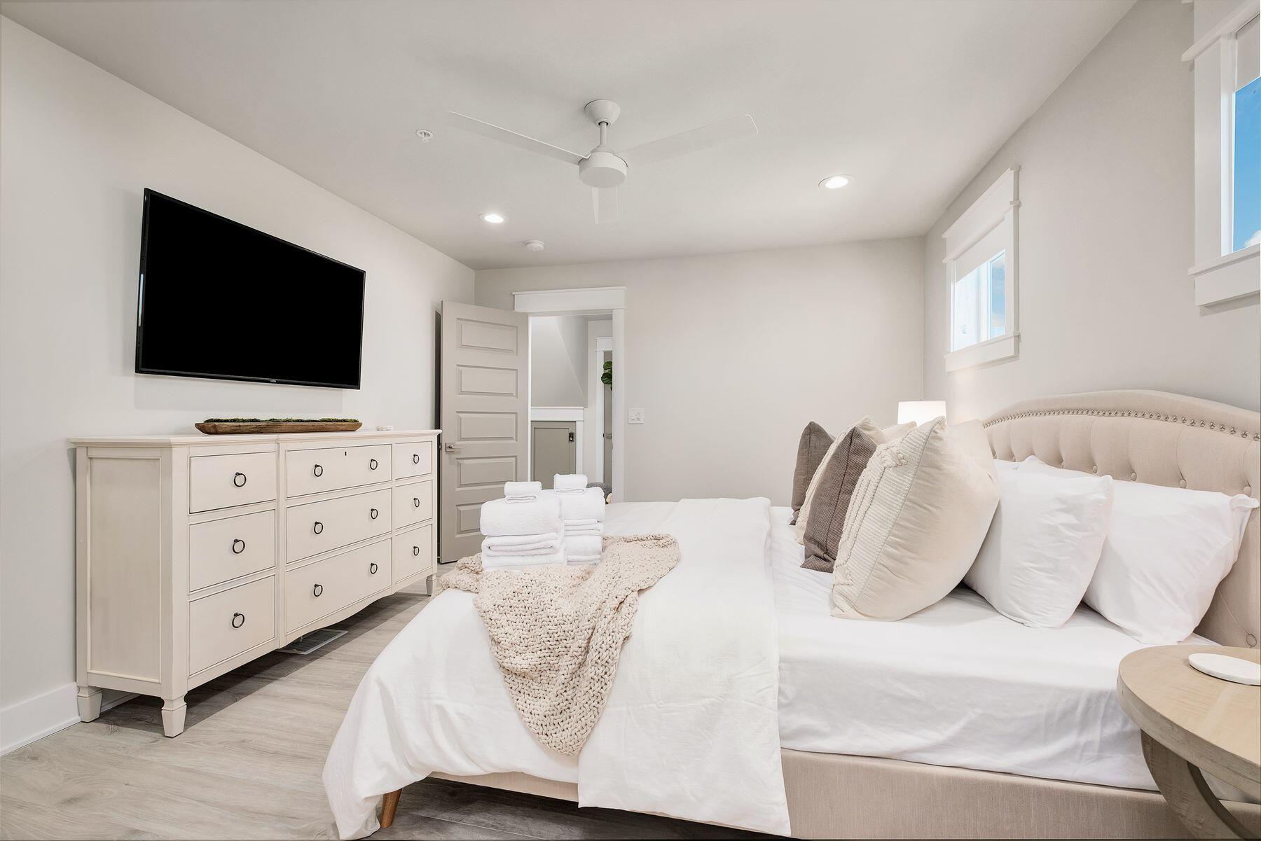 76 Hotz Avenue Santa Rosa Beach, FL 32459 - Photo 50 of 70 a bedroom with a bed and flat screen tv