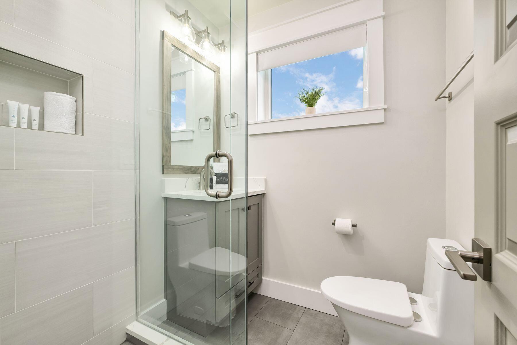 76 Hotz Avenue Santa Rosa Beach, FL 32459 - Photo 51 of 70 a bathroom with a toilet a sink and mirror