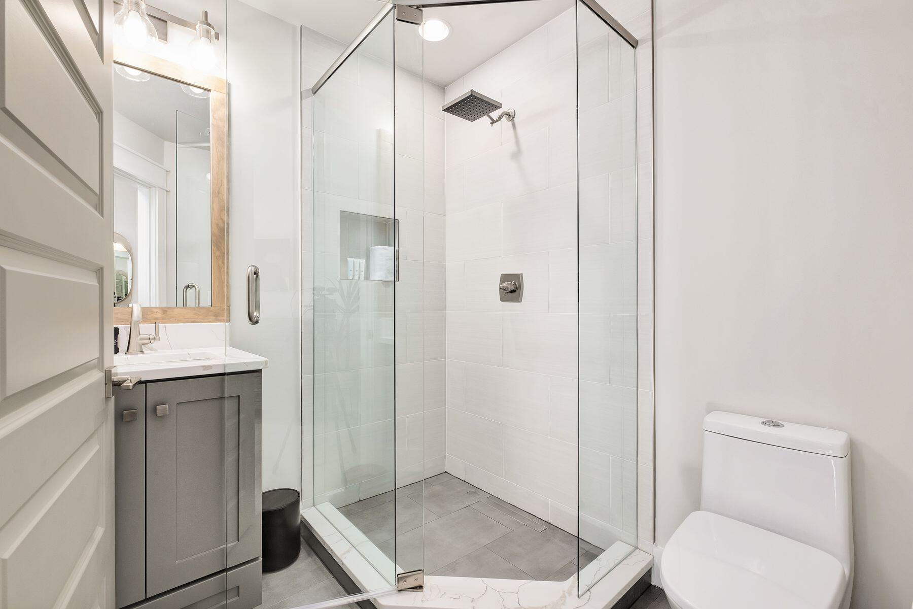 76 Hotz Avenue Santa Rosa Beach, FL 32459 - Photo 53 of 70 a bathroom with a granite countertop sink toilet and shower