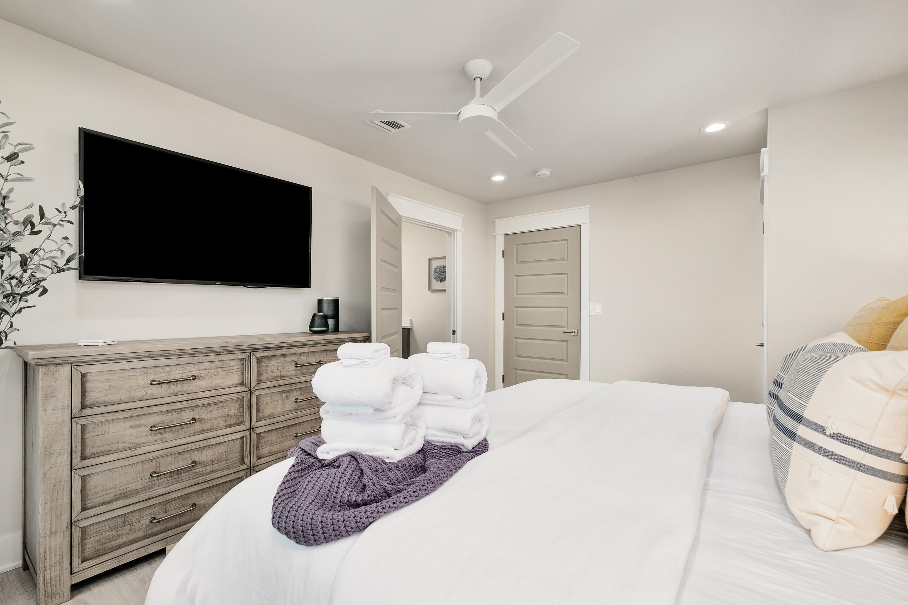 76 Hotz Avenue Santa Rosa Beach, FL 32459 - Photo 53 of 71 a bedroom with a large bed and a flat screen tv