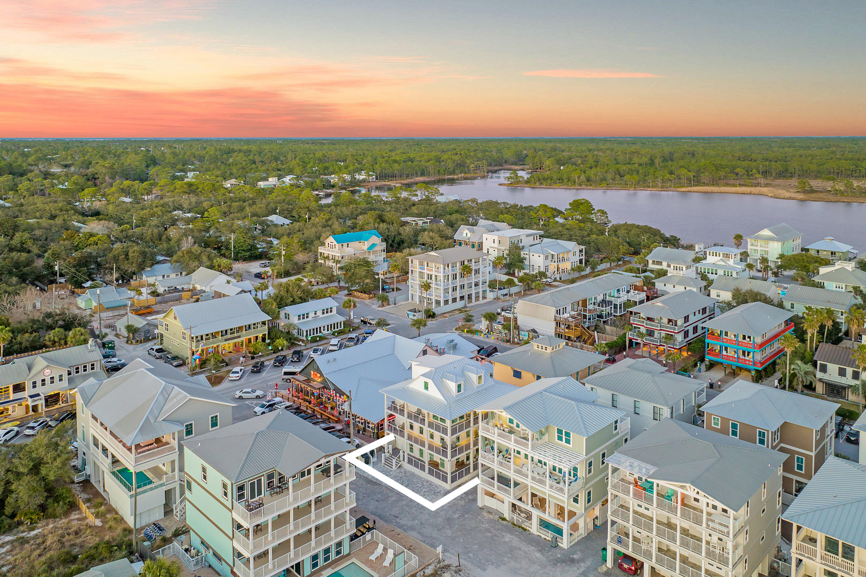 76 Hotz Avenue Santa Rosa Beach, FL 32459 - Photo 64 of 71 an aerial view of a city with lots of residential buildings and ocean view in back