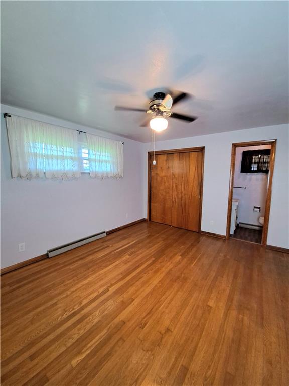 530 Scott Hollow Road Burgettstown, PA 15021 - Photo 12 of 21 an empty room with wooden floor and chandelier fan