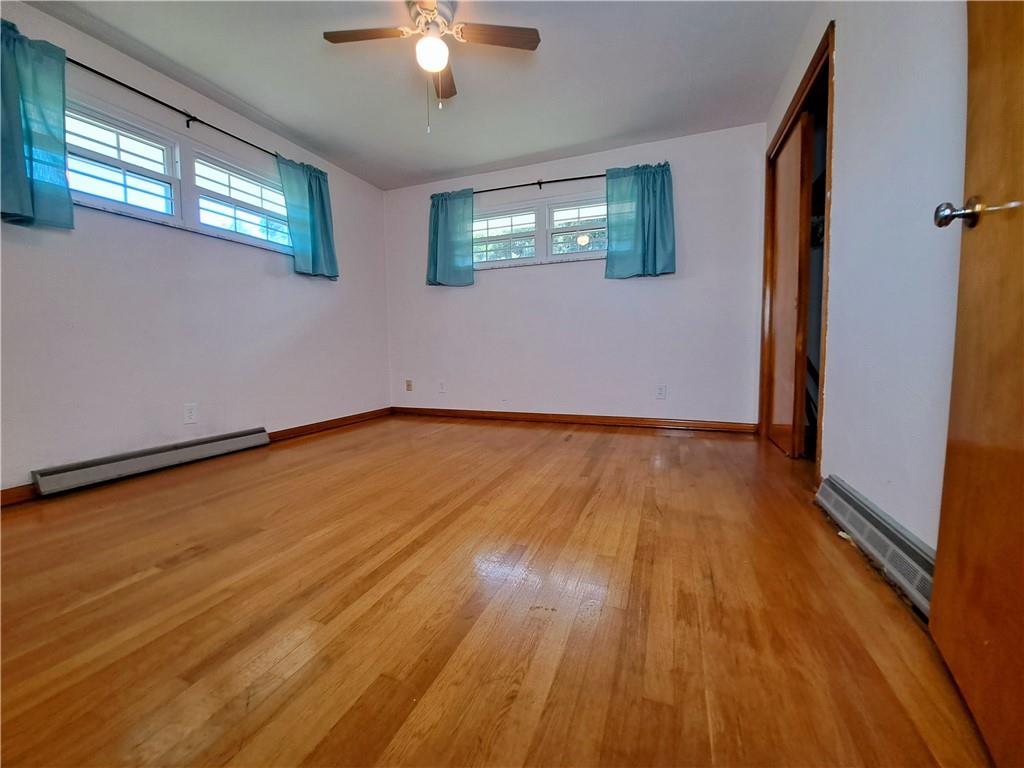 530 Scott Hollow Road Burgettstown, PA 15021 - Photo 16 of 21 a view of an empty room with wooden floor and a window