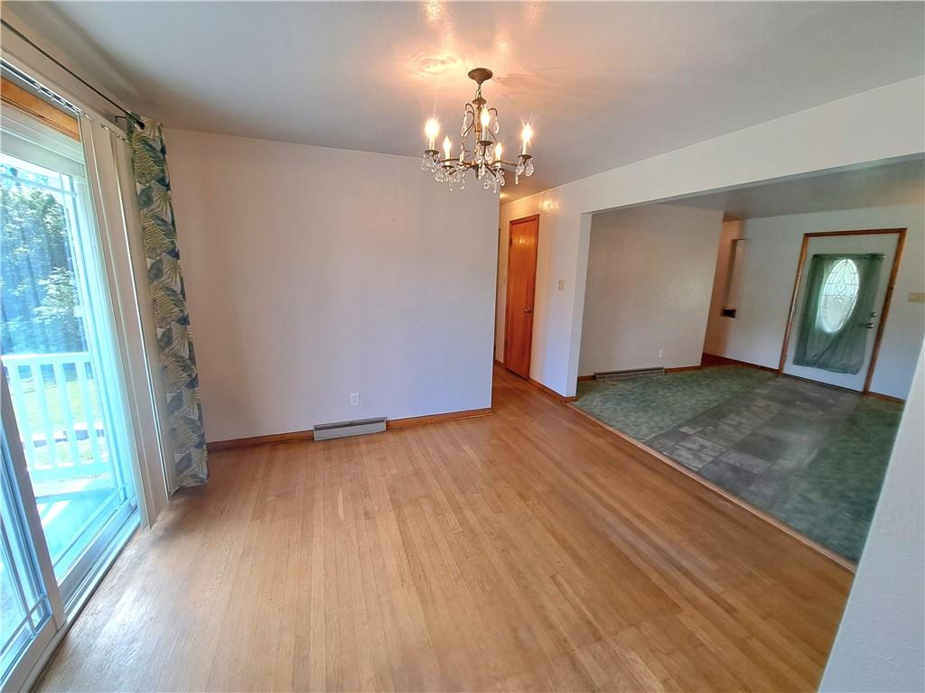 530 Scott Hollow Road Burgettstown, PA 15021 - Photo 7 of 21 wooden floor in an empty room with a window
