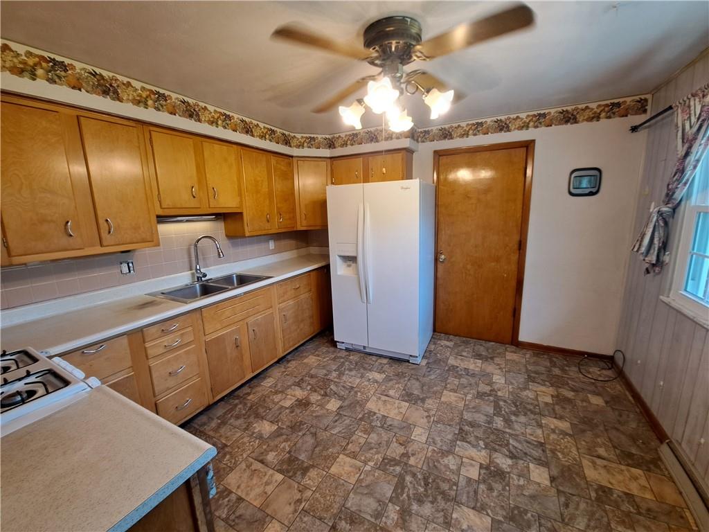 530 Scott Hollow Road Burgettstown, PA 15021 - Photo 8 of 21 a kitchen with stainless steel appliances granite countertop a sink a stove and a refrigerator