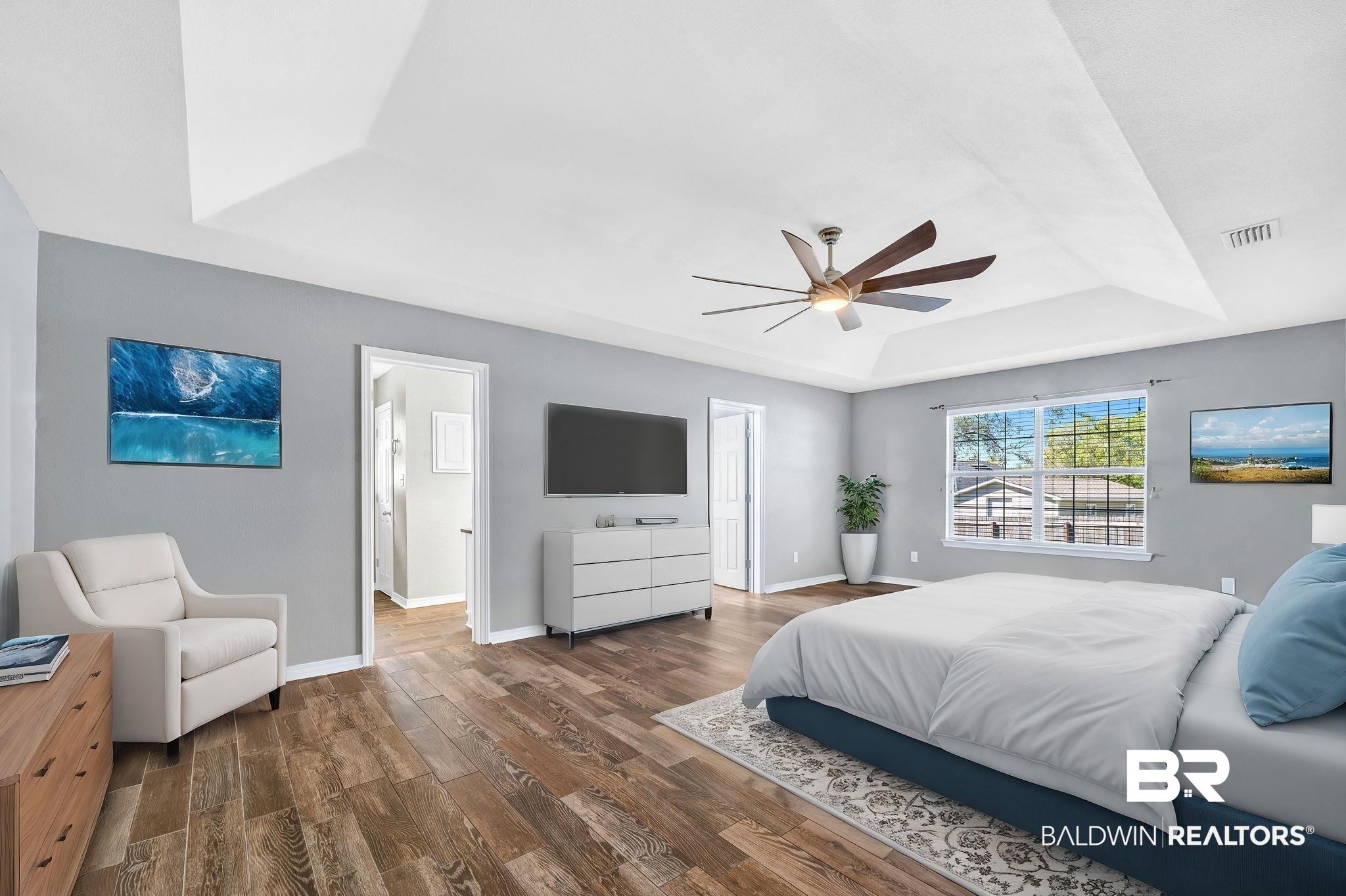 16444 Hamlet Lane Foley, AL 36535 - Photo 41 of 49 Bedroom featuring baseboards, a raised ceiling, visible vents, ceiling fan, and wood finished floors
