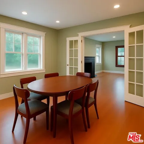 a view of livingroom with wooden floor and windows