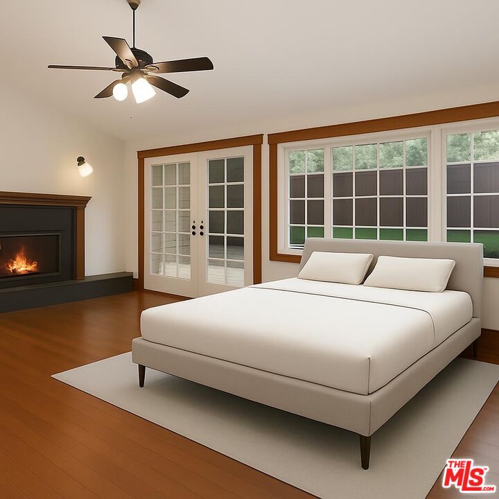 13239 Addison Street Sherman Oaks, CA 91423 - Photo 14 of 29 a bedroom with a bed and a fireplace