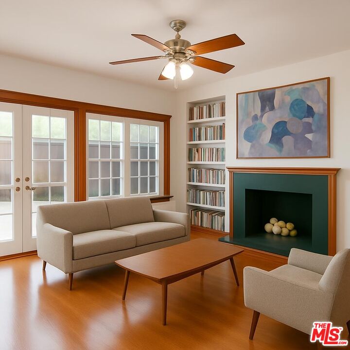13239 Addison Street Sherman Oaks, CA 91423 - Photo 5 of 29 a living room with furniture and a fireplace