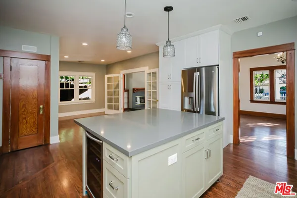 a kitchen with stainless steel appliances granite countertop a sink and a stove