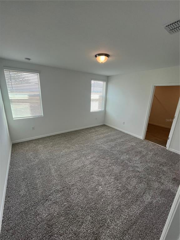 2405 White Tail Street Davenport, FL 33837 - Photo 15 of 24 an empty room with a window