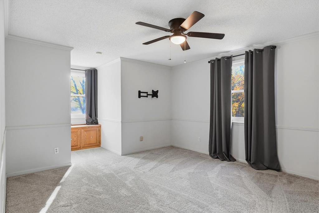 4969 County Road 3502 Wills Point, TX 75169 - Photo 22 of 40 an empty room with closet and windows