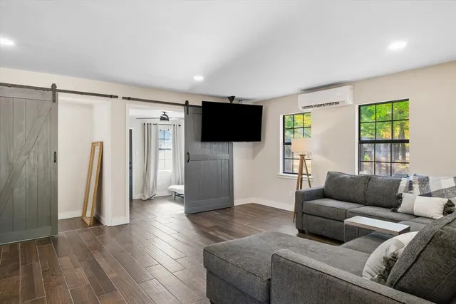 a room with a refrigerator and a sink