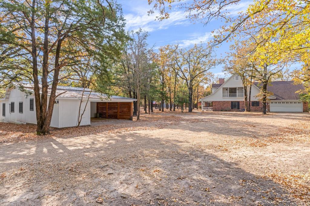 4969 County Road 3502 Wills Point, TX 75169 - Photo 36 of 40 a backyard of a house with oven and a tree