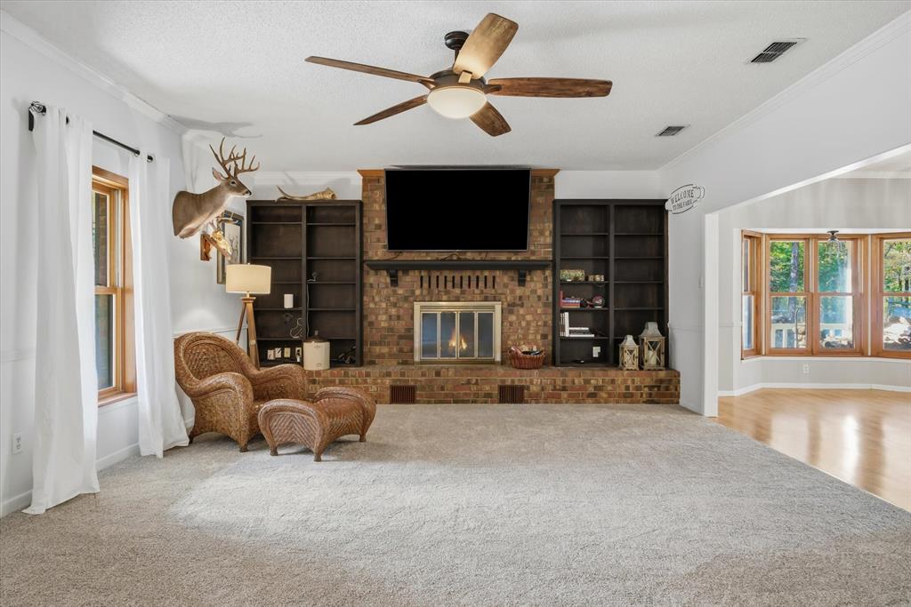 4969 County Road 3502 Wills Point, TX 75169 - Photo 5 of 40 a living room with furniture and a flat screen tv